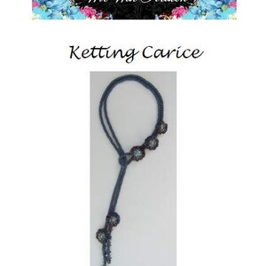 May include: A blue beaded necklace with a flower design. The necklace is made of small beads and has a tassel at the end.
