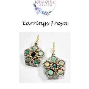 May include: A pair of earrings with a starburst design featuring turquoise, gold, and silver beads. The earrings are named "Freya" and are from the Wir War KRALEN brand.