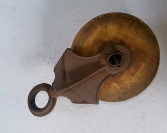 Antique Cast Iron Pulley in very nice working condition 5.5" diam. x 1.4" wood wheel make great industrial or farm hanger or decor
