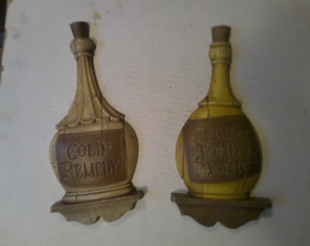 Mrs Jones Tonic and Cold Remedy bottles -set of 2  cast metal apothecary style bottle for wall decor indoors or out - 12" x 5.5" x 1" deep