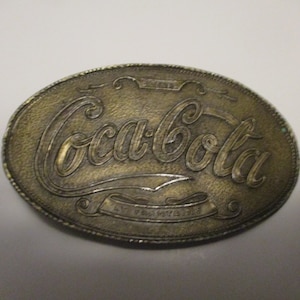 Coca-Cola at Fountains - vintage brass belt buckle advertising promo - 4&quot; oval form for belts 1.75&quot; wide.