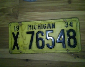 Matrícula de Michigan de 1934 - X76548 - muy buen estado, negra sobre dorado