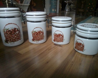 Ceramic Canister Set - 4 piece graduated set - 24, 32, 40 and 48 oz sizes each w wood spoon - decorated w basket of apples - by Alco