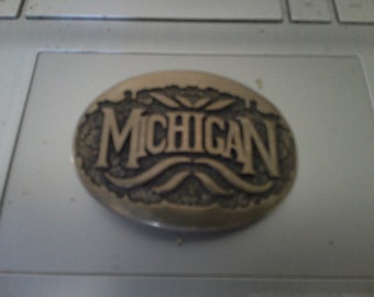 Michigan - Bronze Belt Buckle - 2.75 cast relief oval form for belts up to 1.5" wide- great condition - Text on floral bckgrd