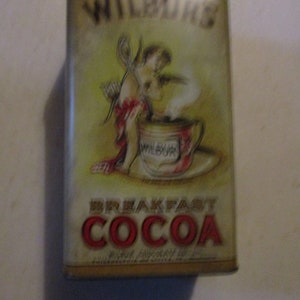 Wilbur&#39;s Breakfast Cocoa - 6.75&quot; high x 4&quot; x 3&quot;  repro tin from 1970s - colorful kitchen storage for chocolate fans of all ages.