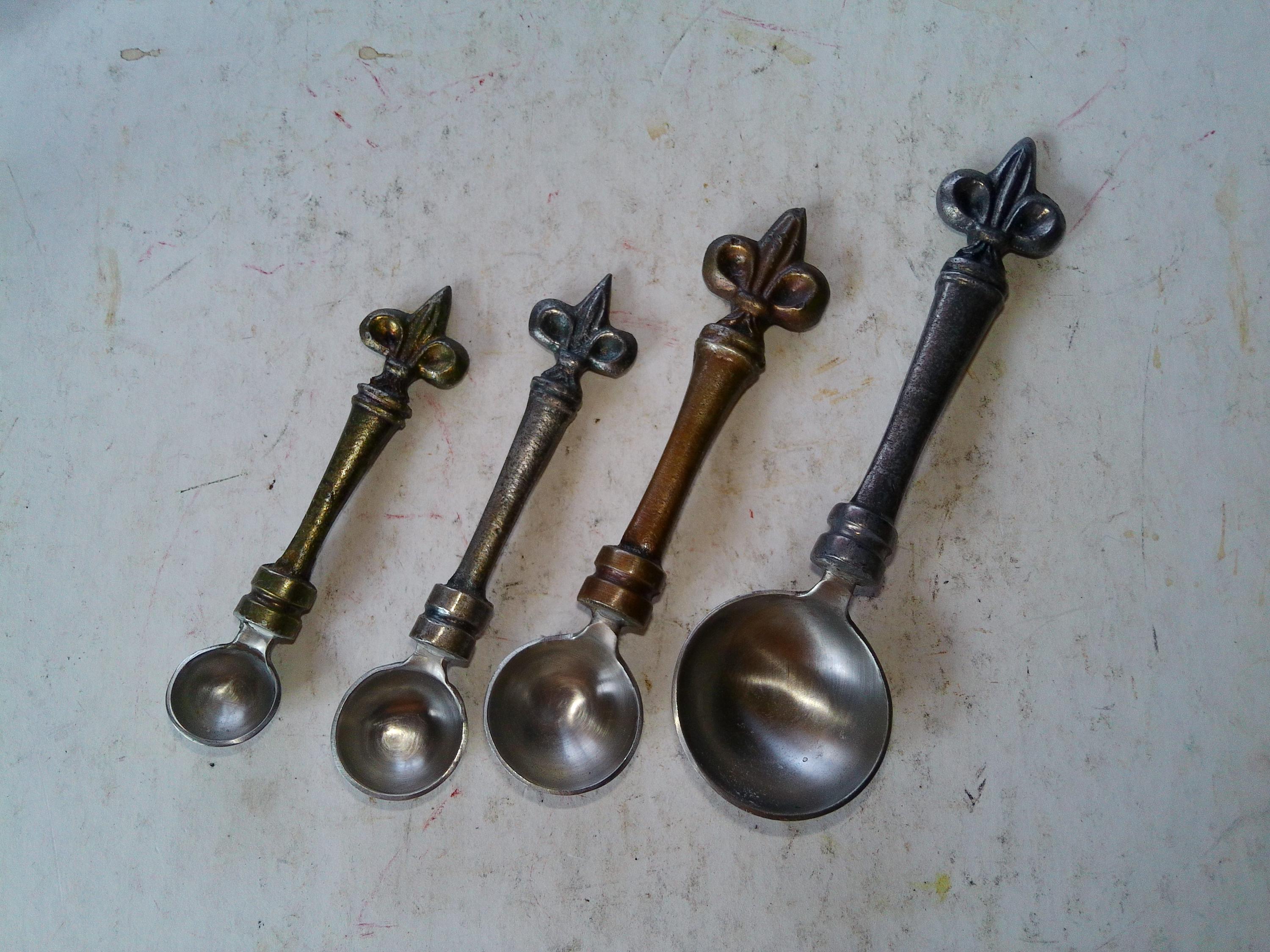 Fleur de Lis Measuring Spoons - 4 piece set w 1/4, 1/3, 1/2, and TSP forms - each with Fleur de lis handle in different colors