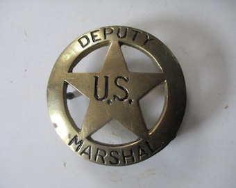 Deputy U.S. Marchal badge shaped brass belt buckle -2.75" diam. open relief star text.  Great condition for belts 1.75 wide.