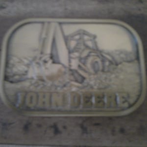 John Deere Backhoe Tractor Belt Buckle - 1983 Deep Relief Cast Brass form by Deere and Co.