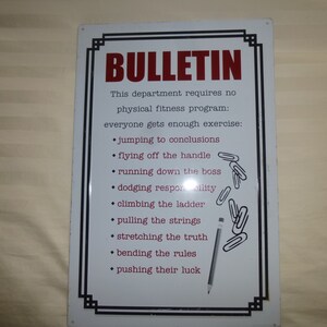 May include: White metal sign with black border and red text that reads "BULLETIN". The sign lists a humorous set of "physical fitness" activities for a department, including "jumping to conclusions", "flying off the handle", and "running down the boss".