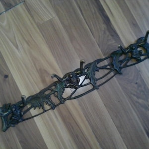 Monkey Coat and Towel Rack -6 hand shaped hanger hooks on 20" x 3.5" high x 2" deep cast brass form