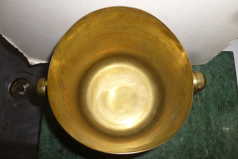 Brass Champagne and Ice bucket fun and functional style in great condition perfect for bar or a mid-mod counter top container