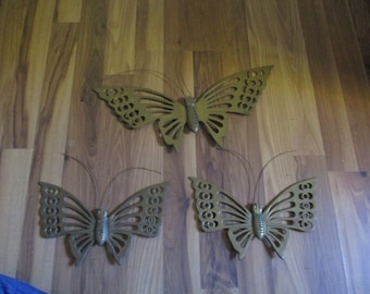 3D Butterflies - 1960s modern brass forms - set of 3  in two distinct sizes - 10.5" and 16.5 wingspans - easy to hang indoors or out.