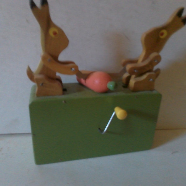 Bunny Rabbit themed Hurdy-Gurdy music box - crank handle form moves 2 rabbits as they saw a carrot like lumberjacks - unknown tune