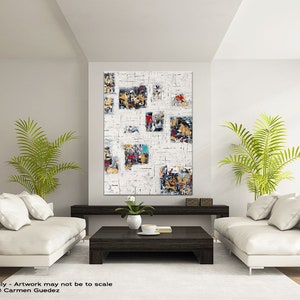 May include: Abstract art painting with a white background and colorful geometric shapes. The painting is hanging on a wall in a living room with two white sofas and a coffee table.