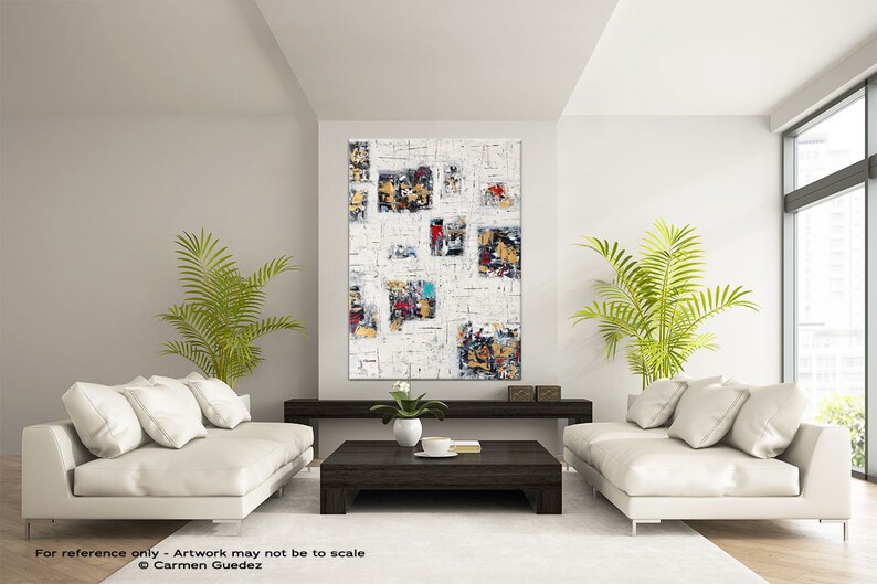 May include: Abstract art painting with a white background and colorful geometric shapes. The painting is hanging on a wall in a living room with two white sofas and a coffee table.