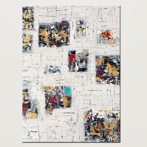 May include: Abstract painting with a white background and colorful squares. The squares are filled with various shades of black, red, blue, and gold. The painting has a textured surface.