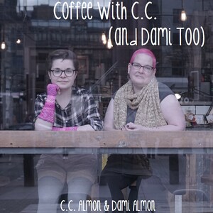 May include: Two people, one with pink hair and a scarf, and the other with short brown hair and pink gloves, are sitting at a table in front of a window. The text "Coffee With C.C. (and Dami Too)" is written above them, and the text "C.C. Almon & Dami Almon" is written below them.