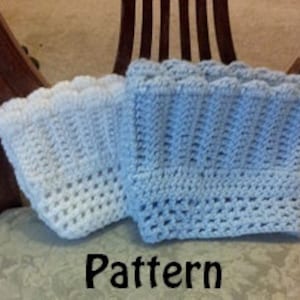 May include: Two crocheted leg warmers, one white and one light blue, with a scalloped edge. The leg warmers are made with a simple stitch pattern and are a great way to keep your legs warm in the winter.
