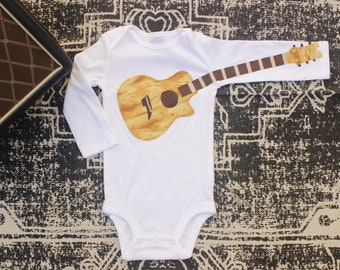 Golden Brown Wood Acoustic Guitar With Gold Strings