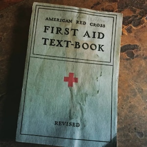American Red Cross First Aid Text Book with 114 illustrations. 1940 softcover medical book