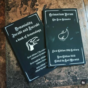 Demonology books. Sold as a set of 2