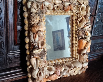 Antique shell art mirror. Very heavy