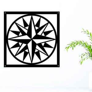 May include: Black metal wall decor featuring a geometric starburst design. The starburst is centered in a square frame.