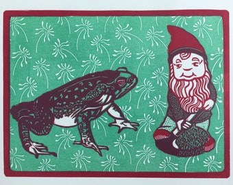 Limited edition, two plate linocut print of a Toad looking at a garden gnome