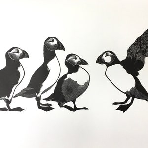 Linocut print of Puffins