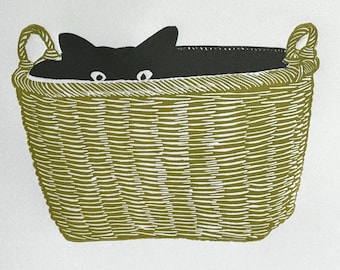 Limited edition linocut print of a cat hiding in a basket