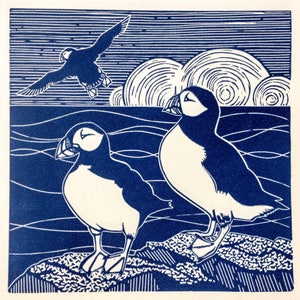 Linocut print of Puffins