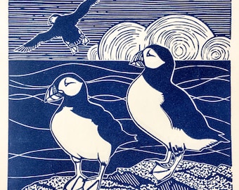 Linocut print of Puffins