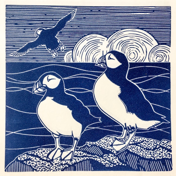 Linocut print of Puffins