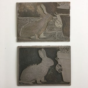 Linocut print of a baby rabbit looking at a snail image 3