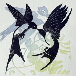 May include: Black and white silhouette print of two birds in flight, facing each other with beaks touching. The birds are surrounded by a floral pattern in shades of green and blue.