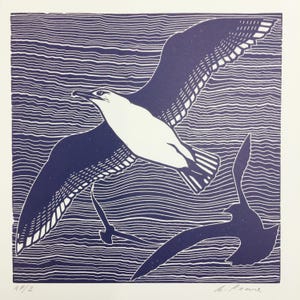 Linocut print of flying seagulls
