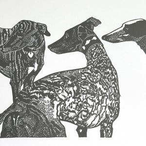 Linocut print of three greyhounds