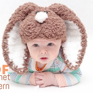 May include: A brown and white crocheted bunny hat with floppy ears. The hat is on a baby's head. The baby is wearing a striped shirt and is lying on its stomach. The text "PDF crochet pattern" is in the lower left corner of the image.