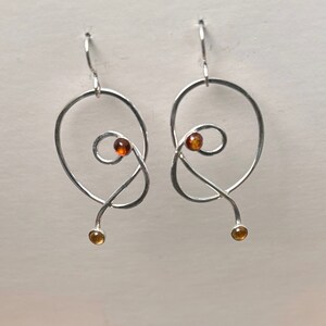 Freeform sterling silver, topaz, and citrine earrings. Earrings are 1 1/2 inches long.
