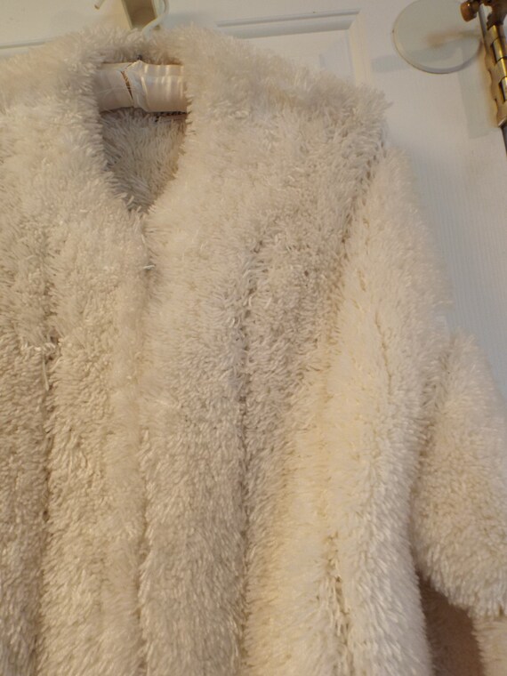 white fuzzy coat