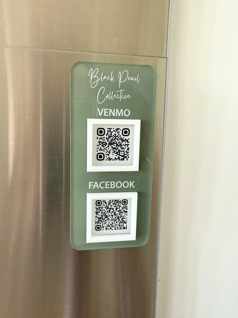 May include: A green and white sign with the text "Black Pearl Collective" and the words "Venmo" and "Facebook" with QR codes underneath.