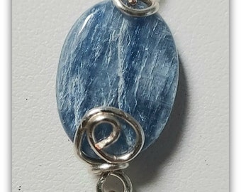 Kyanite Blue Gemstone, wire wrapped in non tarnish wire, so nice for the price,cord optional,12 x 16 mm, ready to ship,