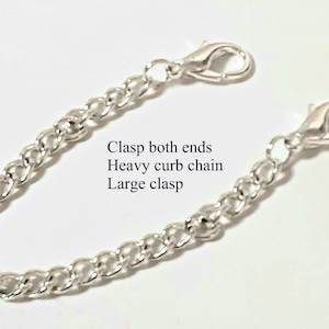 May include: Silver curb chain with large clasps on both ends. Clasp both ends Heavy curb chain Large clasp