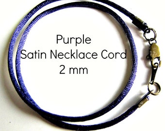 May include: Purple satin necklace cord, 2 mm wide, with a lobster clasp closure.