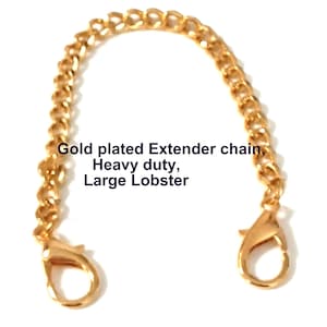 May include: Gold-plated extender chain with a heavy-duty design. The chain features a large lobster clasp on each end. The text on the image reads: Gold plated Extender chain, Heavy duty, Large Lobster.