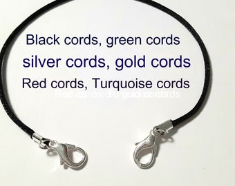 May include: Black, green, silver, gold, red, and turquoise cords with silver lobster clasps.