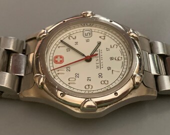 Reloj para hombre WENGER SWISS Army Knife esfera blanca ventana de fecha segundero de cuarzo vintage envio gratuito. Haga clic en los detalles del articulo para obtener mas informacion Etsy Mexico