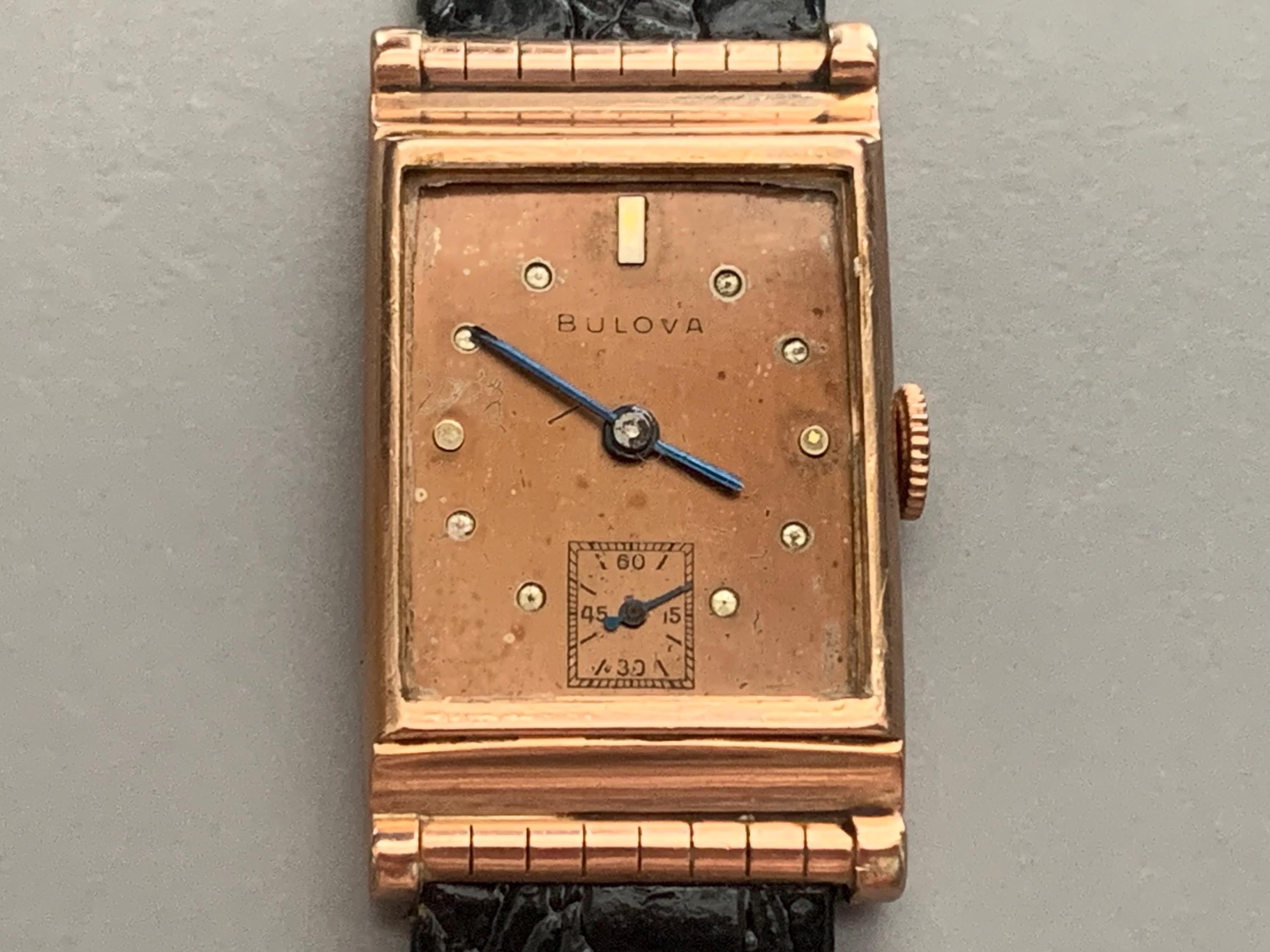 Bulova 14k gold watch value hot sale