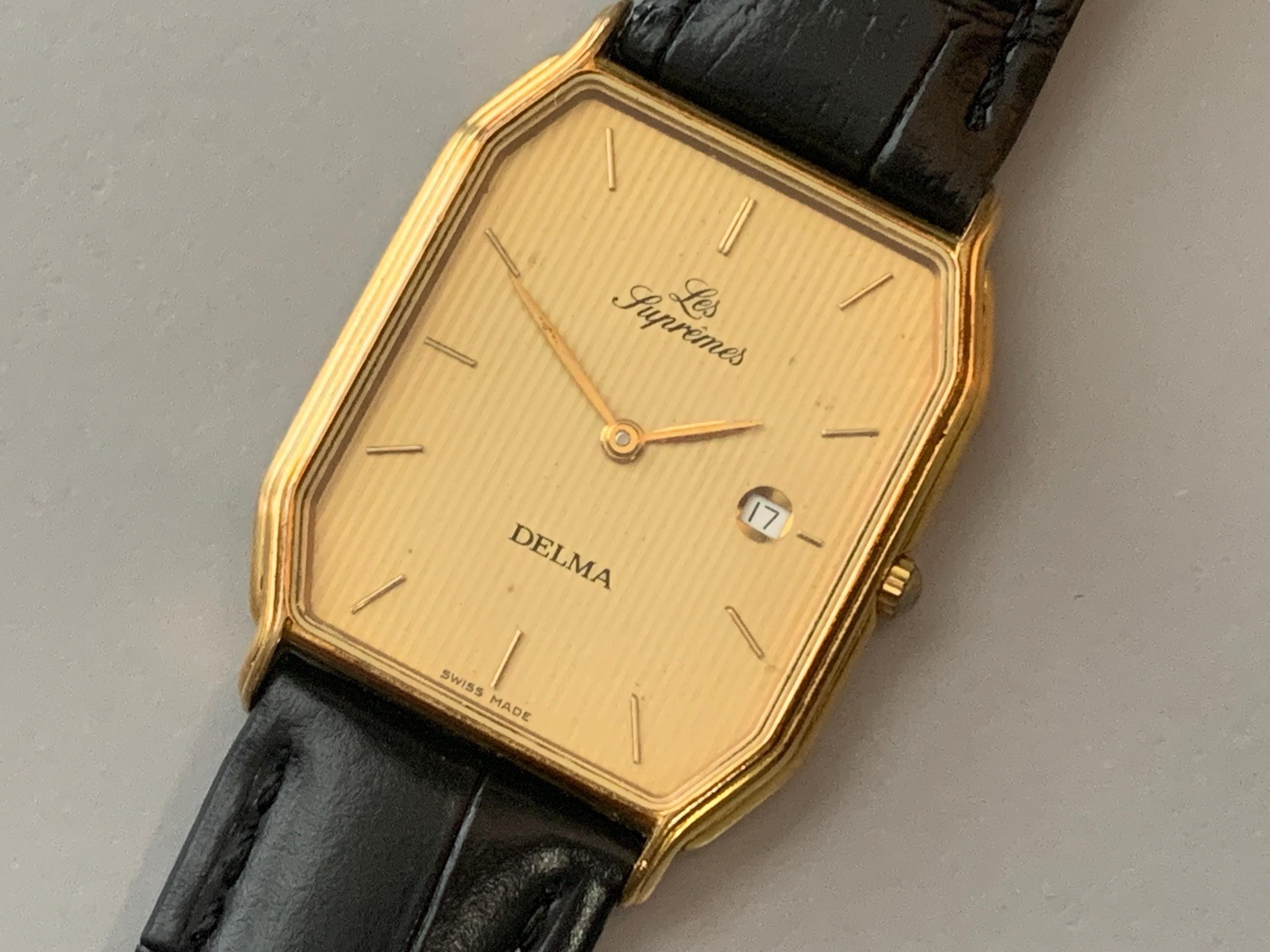 Mens Delma Les Supremes Watch: 18K Gold Plate Swiss Click & Read 