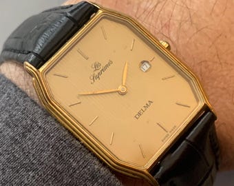 Mens Delma Les Supremes Watch: 18K Gold Plate Swiss Click & Read
